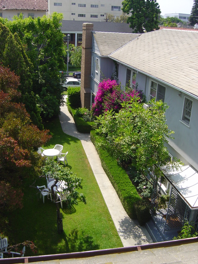 Garden space shared by tenants - 144 S Roxbury Dr