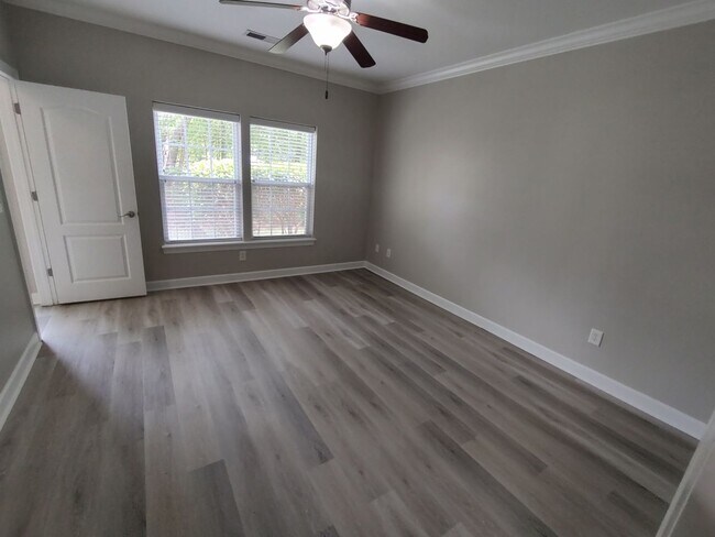 Building Photo - BRAND NEW FLOORING & FRESH PAINT - 3 Bedroom/2.5 Bath Townhome with garage in Wild Wing!