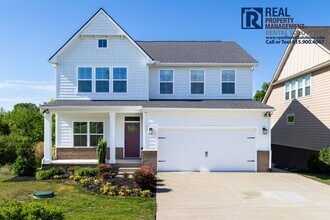 Building Photo - Great 4 bd 2.5 ba with attached garage and large deck!