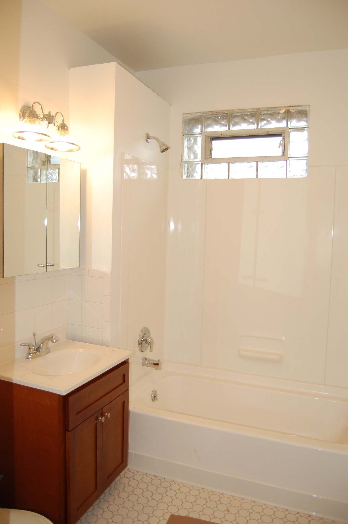 New bathroom with custom cabinetry - 485 Elmwood Ave