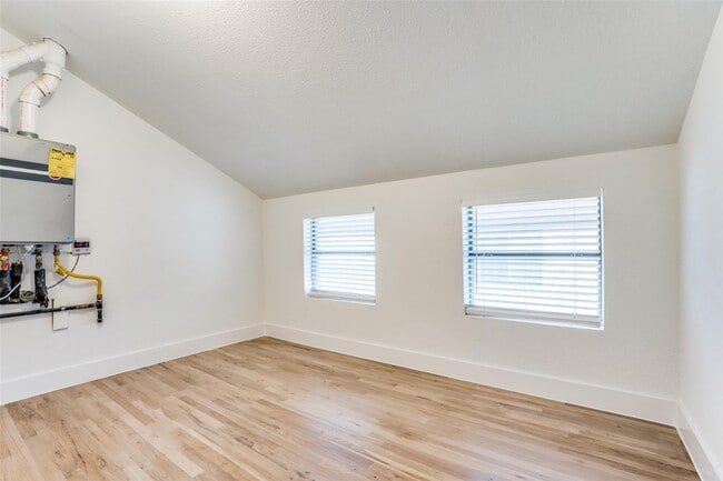 Building Photo - Beautiful townhome featuring granite countertops, hard wood floors, and a small private yard grea...