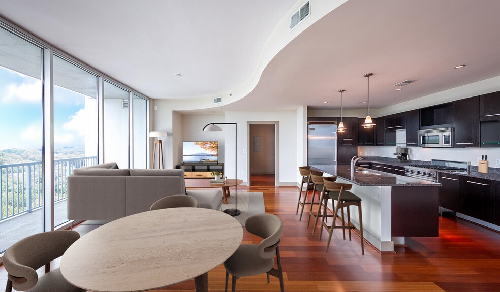 Spacious living room features floor-to-ceiling windows with amazing views of Buckhead - Mezzo