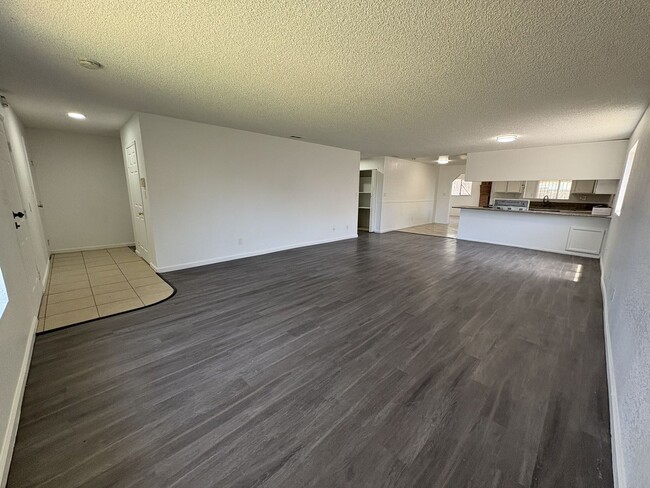 Building Photo - Large Living Area, rear yard has RV Access!