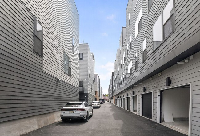 Building Photo - Garage parking, private outdoor space, and skyline views—this Northern Liberties home checks ever...