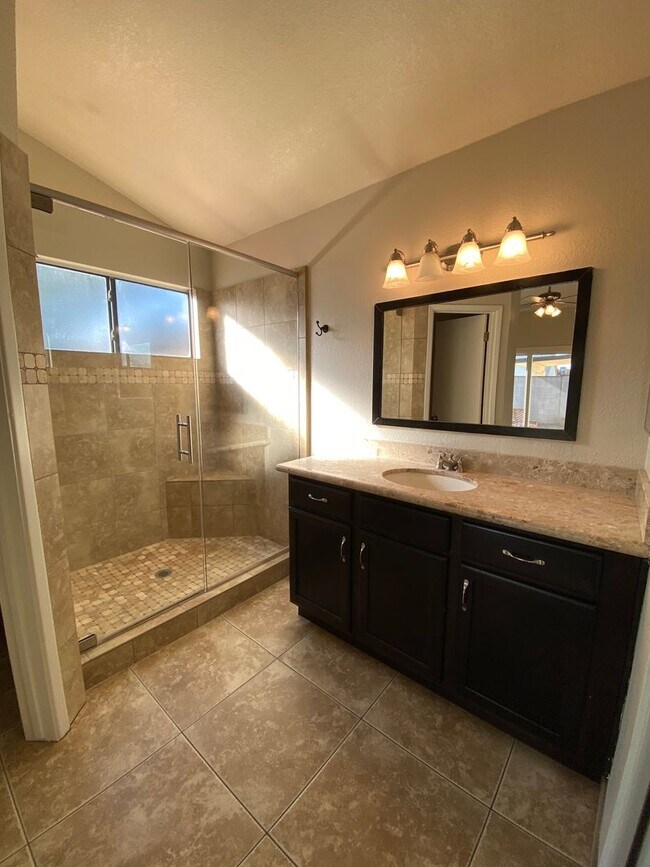 Building Photo - Quaint Retreat: 2BR/2BA Haven with Private Yard, Vaulted Ceilings & Cozy Fireplace