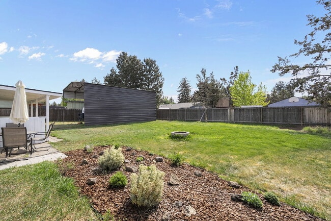 Building Photo - Charming 3-Bedroom Bend Home on 1/2 Acre with Expansive Yard, Mature Trees & Covered RV/Boat Storage