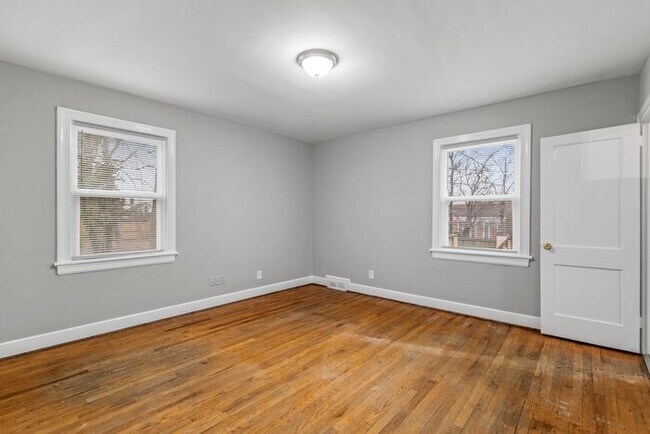 Building Photo - Brick home, Two Story, Hardwoods, DR, 2 Sun Rooms, FP, Carport!.