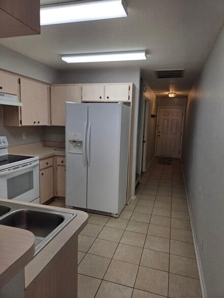 Kitchen facing entry way and garage entrance - 682 Green Valley Rd