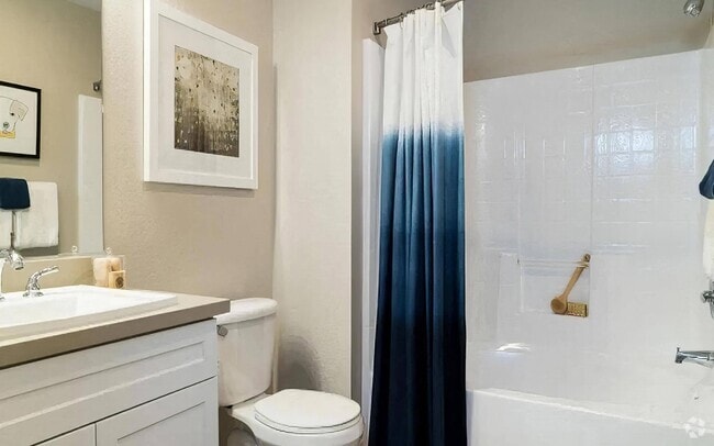 Modern Bathroom with White Vanity and Sleek Fixtures - Amerige Pointe