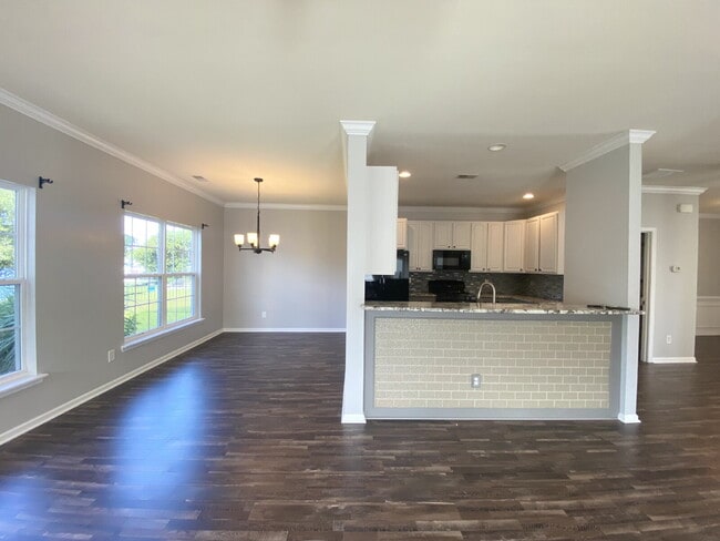 Building Photo - Three Bedroom Home with fenced-in Backyard oasis!