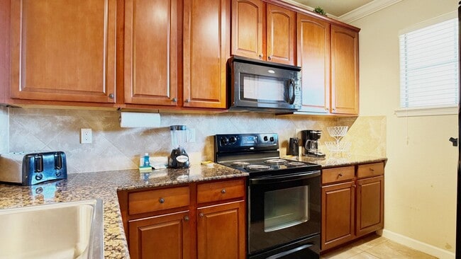 Building Photo - Move-in ready and Fully Furnished! This beautifully maintained 3-bedroom, 3-bath Condo offers a R...