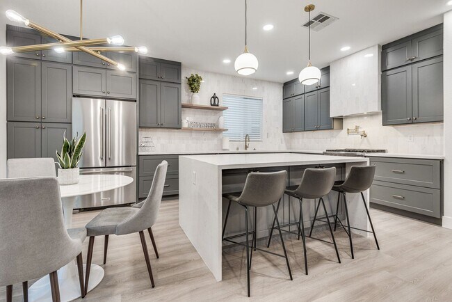 Building Photo - FULLY FURNISHED! Exudes sophistication with designer touches throughout