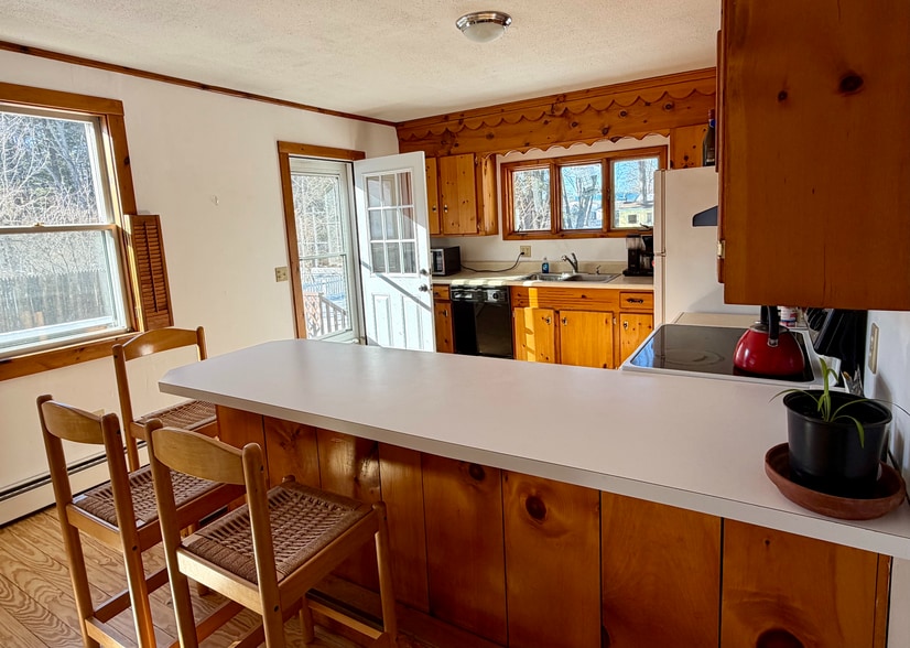 kitchen with door out to deck - 34 Boody St