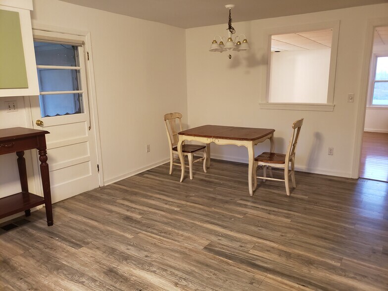 Plenty of room for a large dining table. Pass through lets more light into living room. - 10106 Wingfield Rd