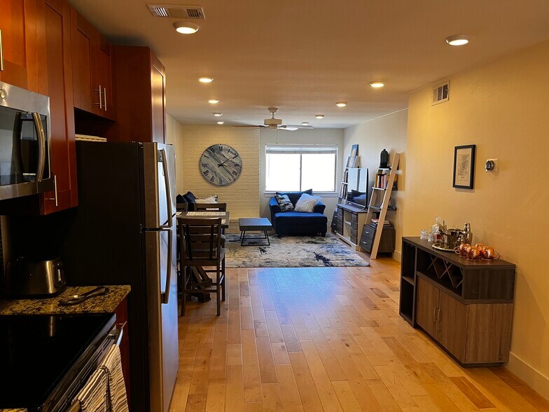 Living room, as viewed from the kitchen. - 909 Reinli St
