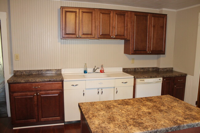 Kitchen - with plenty of cabinets and original farm sink. - 710 Clark st