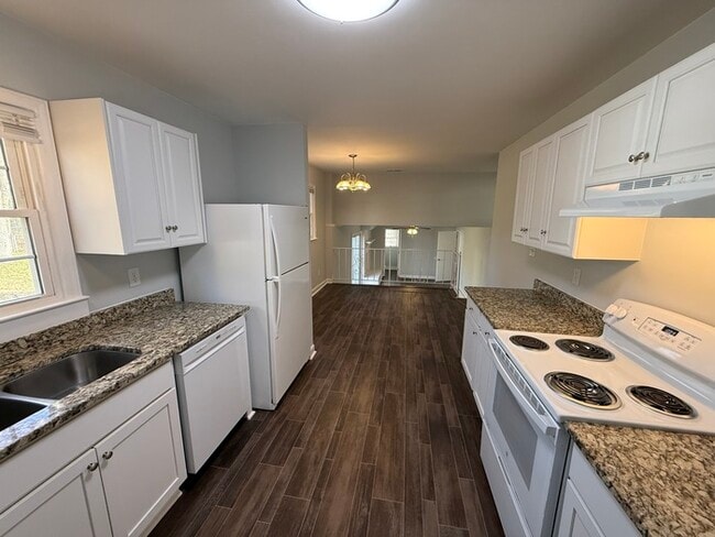 Building Photo - BIG House & BIG Fenced Yard. Plus Master Suite, Den, Shed, and More!