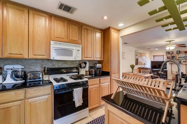 Building Photo - Discover Your Austin Oasis: Revitalized Bungalow with Hardwood Floors and Entertainer's Deck!