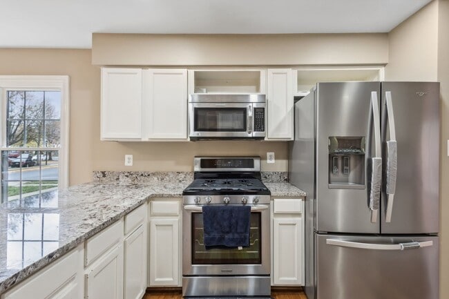 Building Photo - Modern Brick End-Unit Townhome with Stunning Upgrades and Serene Wooded Views