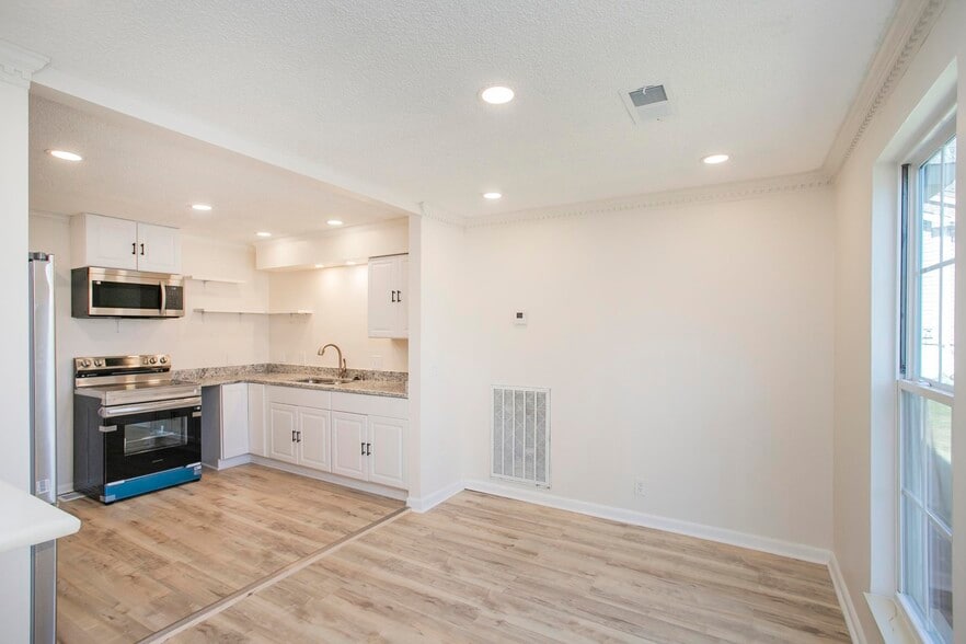 Beautifully updated kitchen designed to impress, featuring granite countertops and stainless steel a - 105 Jacksons Retreat Ct