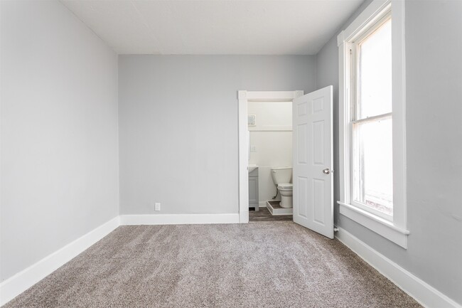 Bedroom with newly renovated half bath! - 1150 Tecumseh St