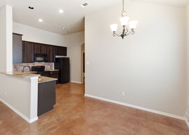 Building Photo - 3 Bedroom Duplex with Stained Concrete Floors and Greenbelt Views!