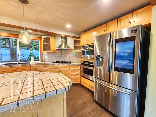 Building Photo - MOVE-IN SPECIAL: 50% OFF FIRST MONTHS RENT - Waterfront Rustic Retreat with Vaulted Ceilings, Pic...
