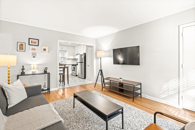 Living room with Kitchen view - 881 North Highland Apartments