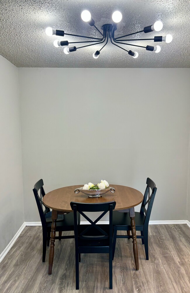 beautiful dining room area with modern lighting - 3801 Swann Rd