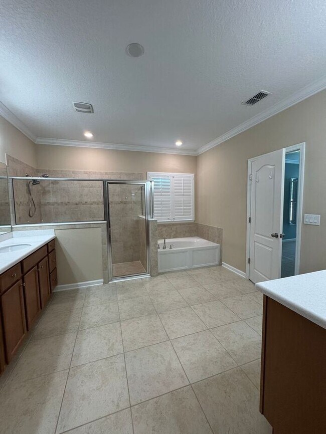 Building Photo - COMING SOON! Beautiful 4BR 3BA Home w/ Screened Lanai & Pond View • Garage Parking • Fenced Yard ...