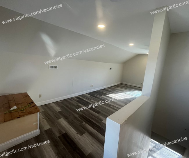 Building Photo - 3 Bedrooms • 1 Large Bathroom, Master suite is a spacious 2nd-floor loft-style bedroom with added...