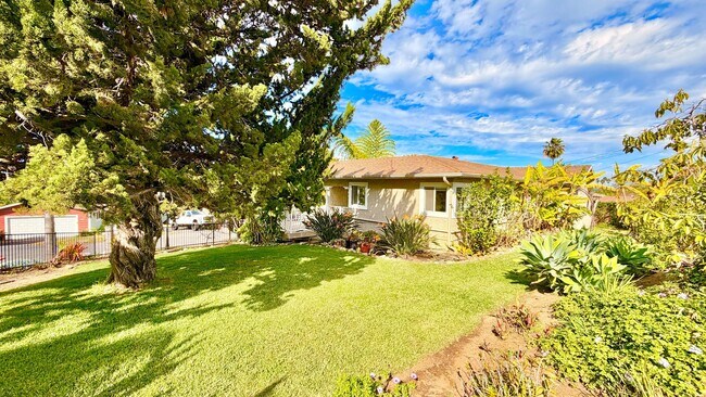 Building Photo - Beautiful Craftsman-style Home with fenced yard space, detached garage and additional parking in ...