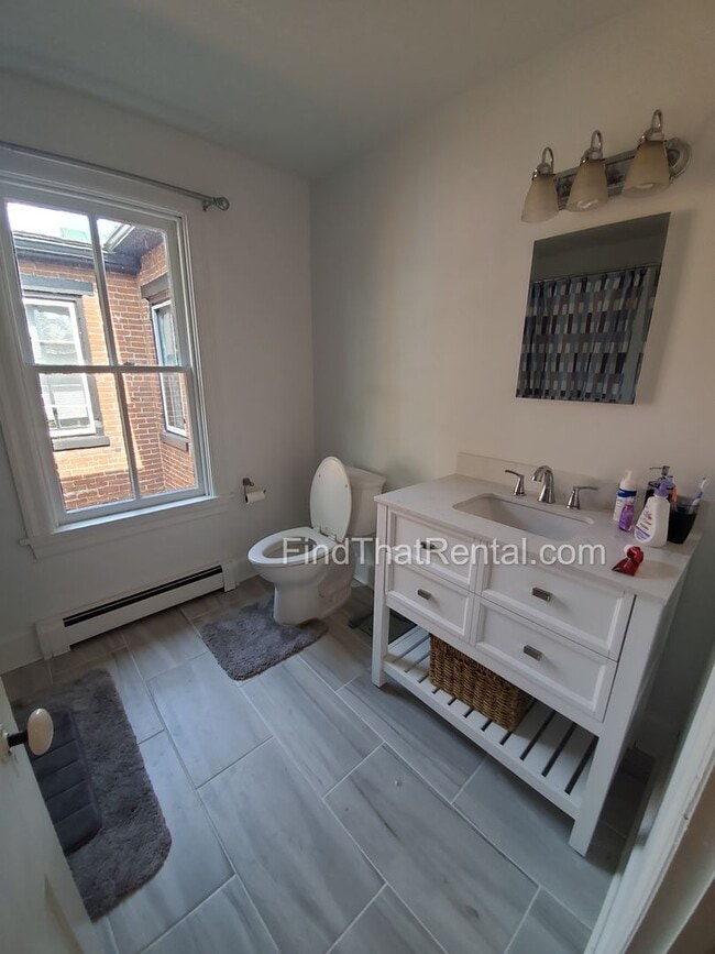 Building Photo - Charming Historic Retreat with Private Fenced Yard & Parking – Prime Downtown Location