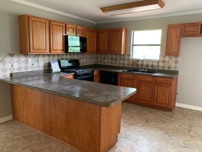 Building Photo - 4/2 Fenced Yard and Pet Friendly. SHISD