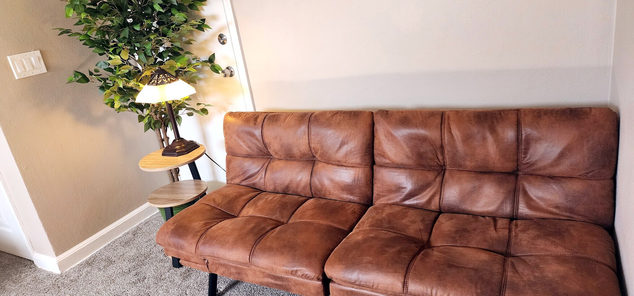 Extra lounge space with futon and reading light - 822 E 4th St