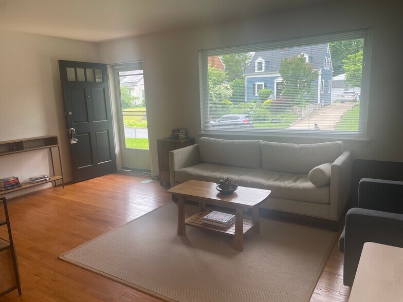 Foyer and living room. Great light! Wood floors! - 9707 Bristol Ave