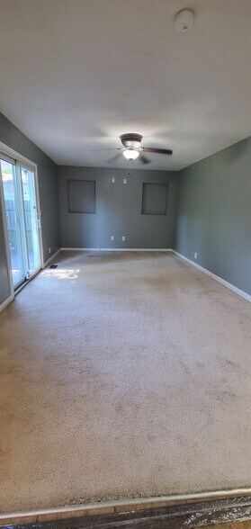 Living room/dining room off kitchen with sliding door to backyard - 313 Britanna Dr