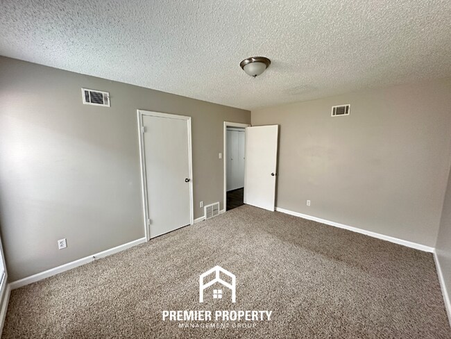 Building Photo - Quiet 3BR/2BA Cove Near Southwind | Soaring Ceilings & Floor-to-Ceiling Stone Fireplace