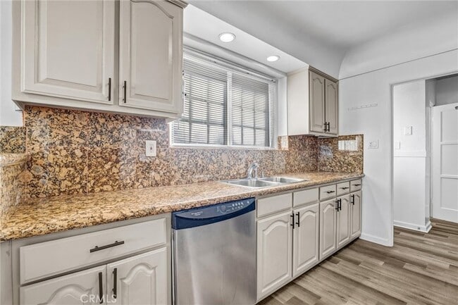 Building Photo - 9807 S Denker Ave