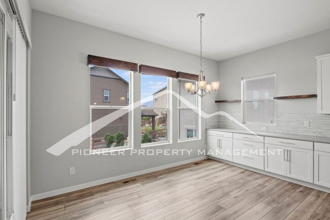 Building Photo - Elegant Ranch-Style Home with Main Floor Primary Bedroom with 3-Car Garage and Finished Basement ...