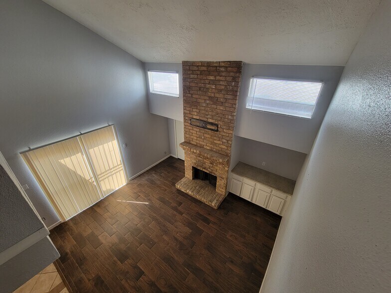 Secondary stairwell looking at livingroom - 12247 W Village Dr