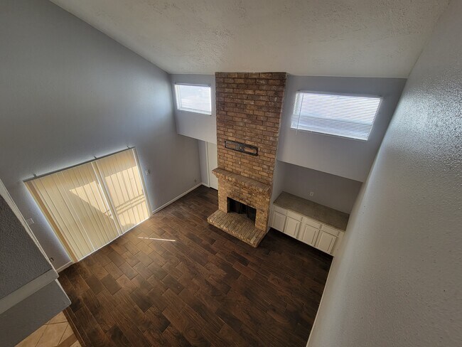 Secondary stairwell looking at livingroom - 12247 W Village Dr
