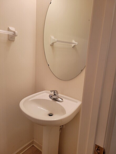 Guest powder room with commode - 221 Victoria Commons Blvd
