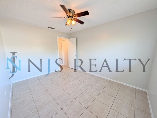 Building Photo - Beautifully updated 3/2/2 1500 Sq. Ft. with fenced yard, tile floors, HUGE living room and a corn...