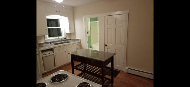 Roomy Kitchen with a center island for your cooking needs! Recently updated floors! - 83 Elm St