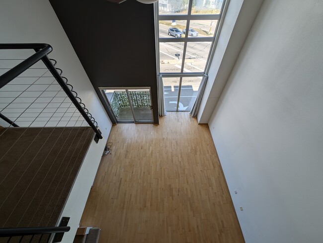 Looking over the loft railing down to the living room - 2121 S Kinnickinnic Ave