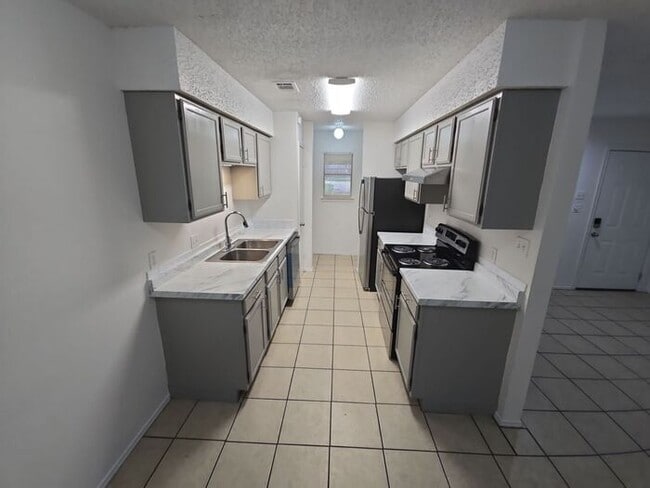 Building Photo - **Updated 2 Bed Home with Covered Carport ...