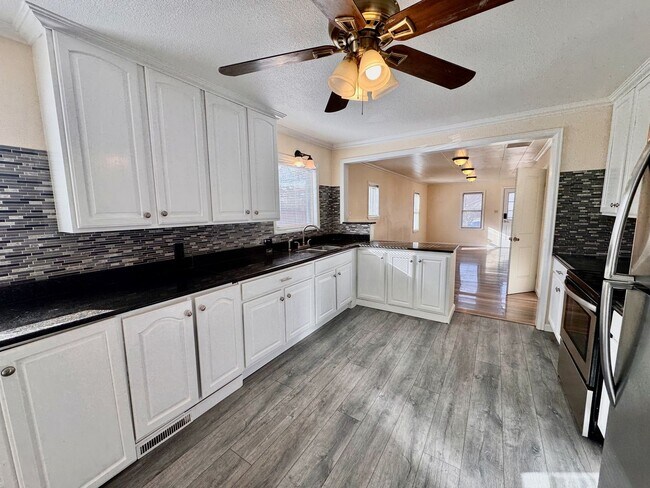 Building Photo - Move-In Ready 4BR Home with Finished Basement, Flex Space & Large Yard