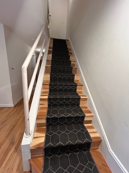 Stairs to bedrooms on upper level - 407 McCauley St