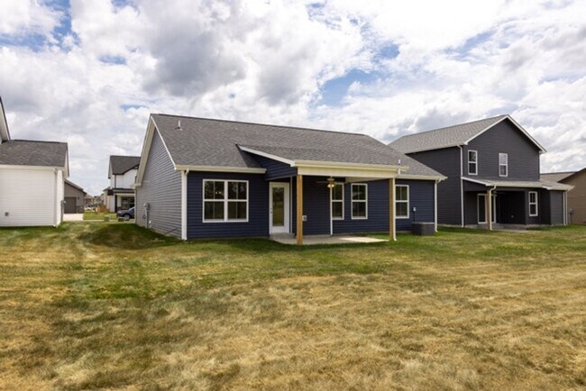Building Photo - Modern Living Redefined with Stone Fireplace, Gray Cabinetry, Spa Inspired Primary Suite and Cove...
